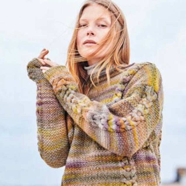 woman wearing cable knit sweater