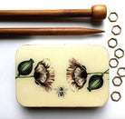 metal tin with flower and bee artwork