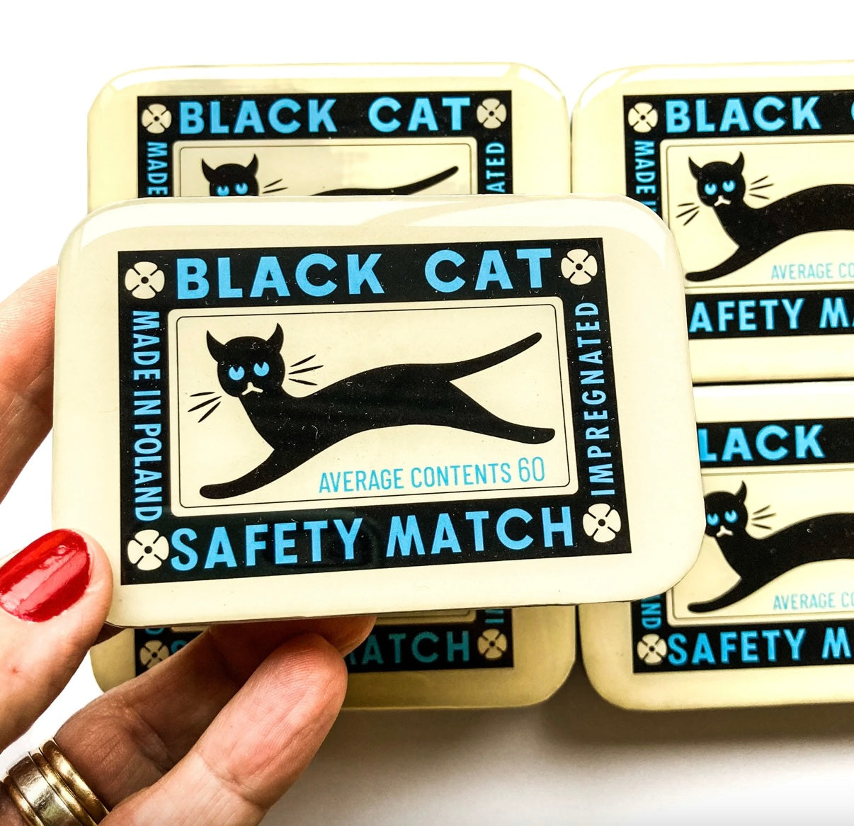 metal tin with retro cat artwork