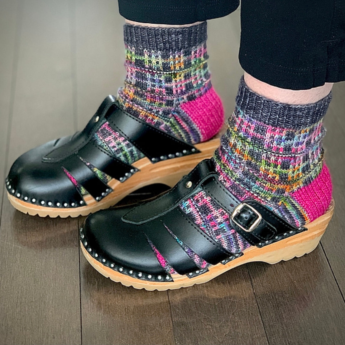 woman wearing clogs and hand knit socks
