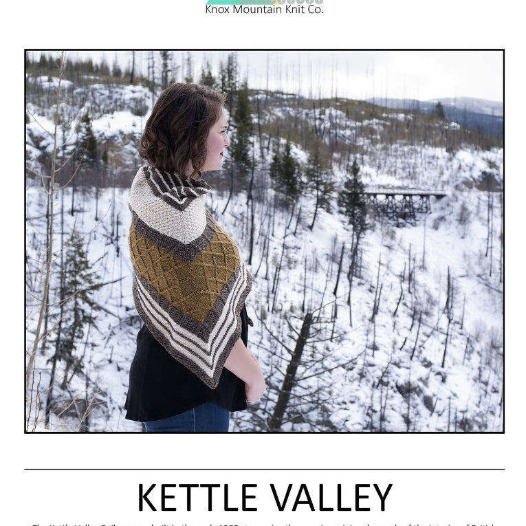 woman standing in nature wearing hand knit shawl