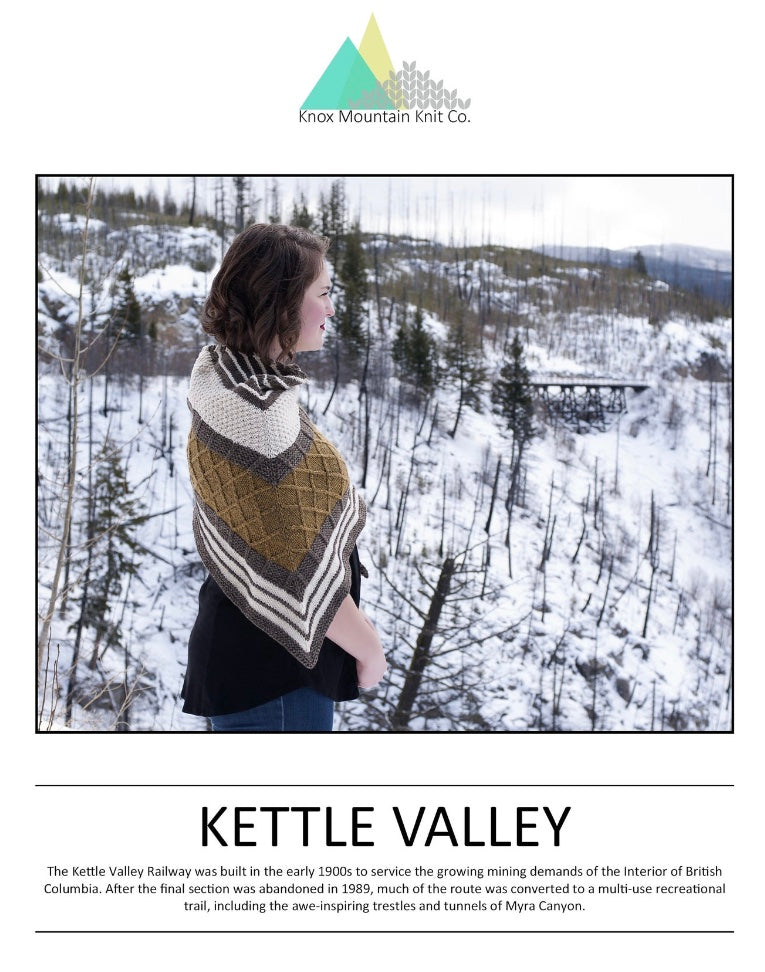 woman standing in nature wearing hand knit shawl