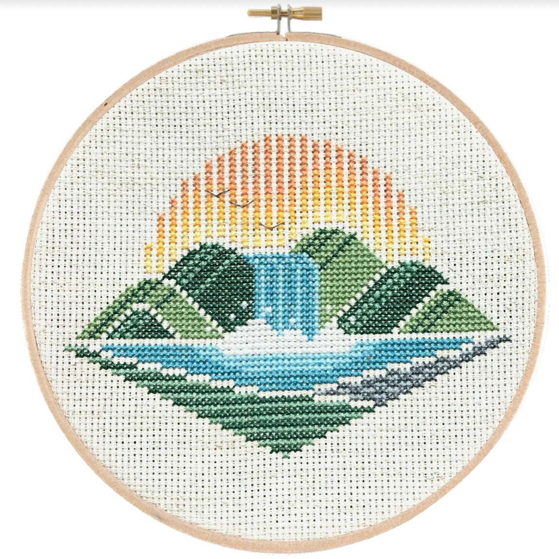 cross stitch of waterfall and sun set