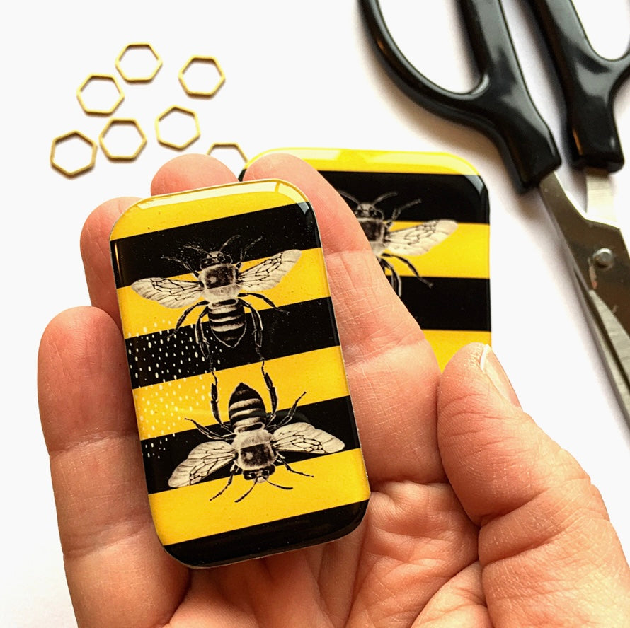 metal tin with bees artwork
