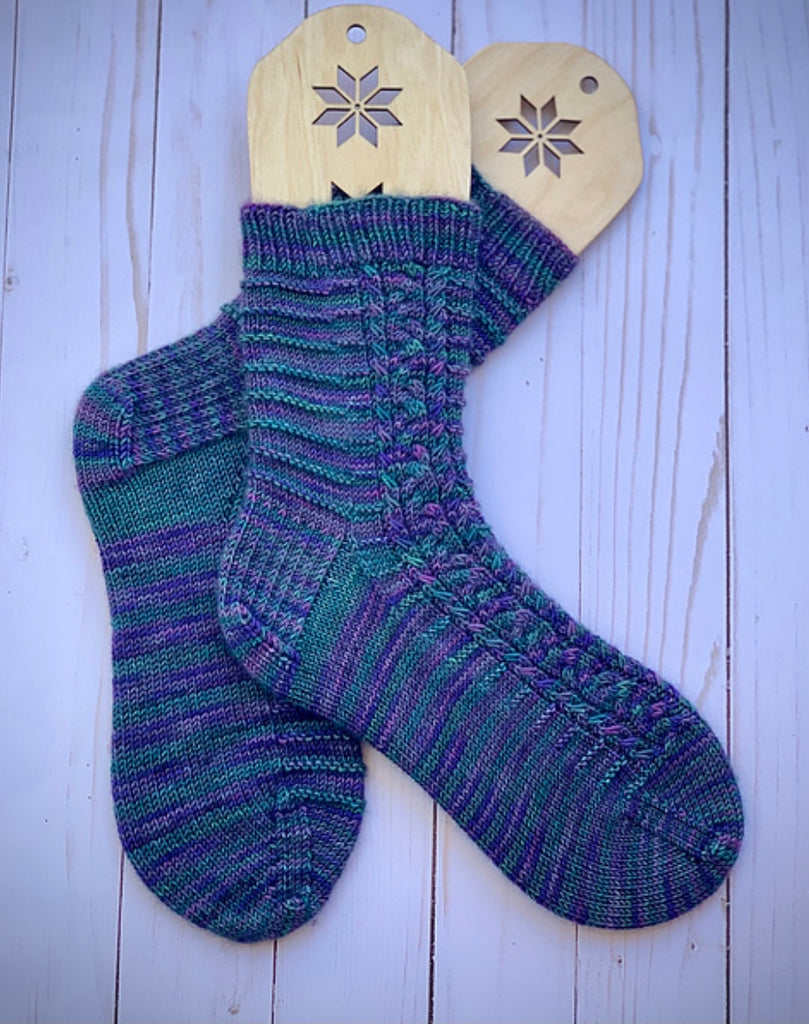 hand knit socks displayed on sock blockers