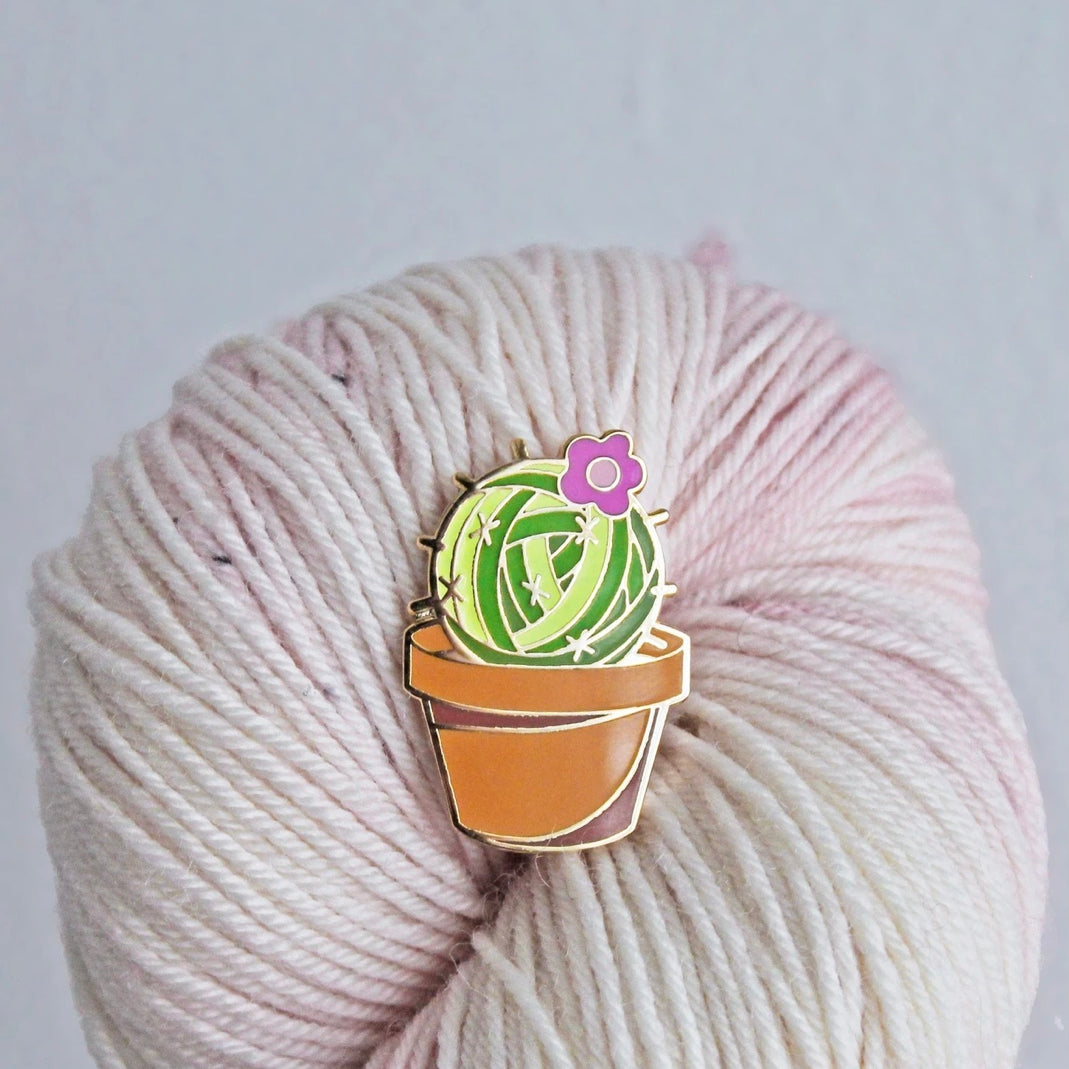 enamel pin of a cactus