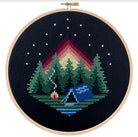cross stitch on black canvas tent campfire forest