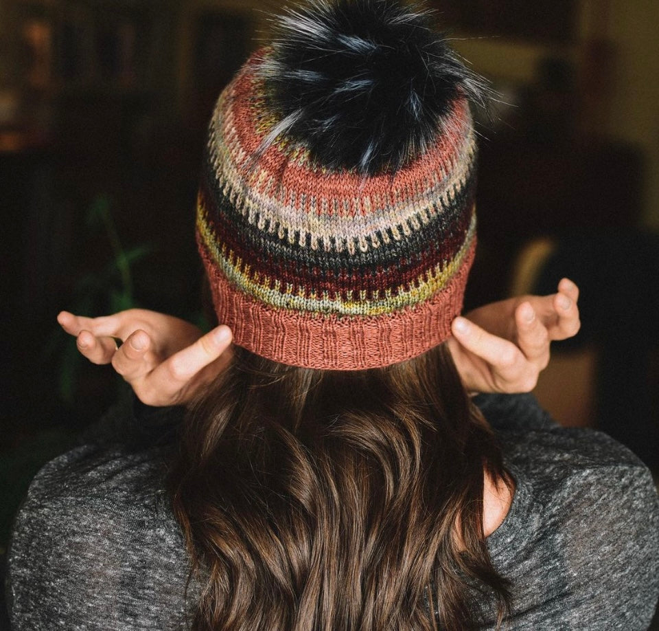 woman wearing hand knit hat
