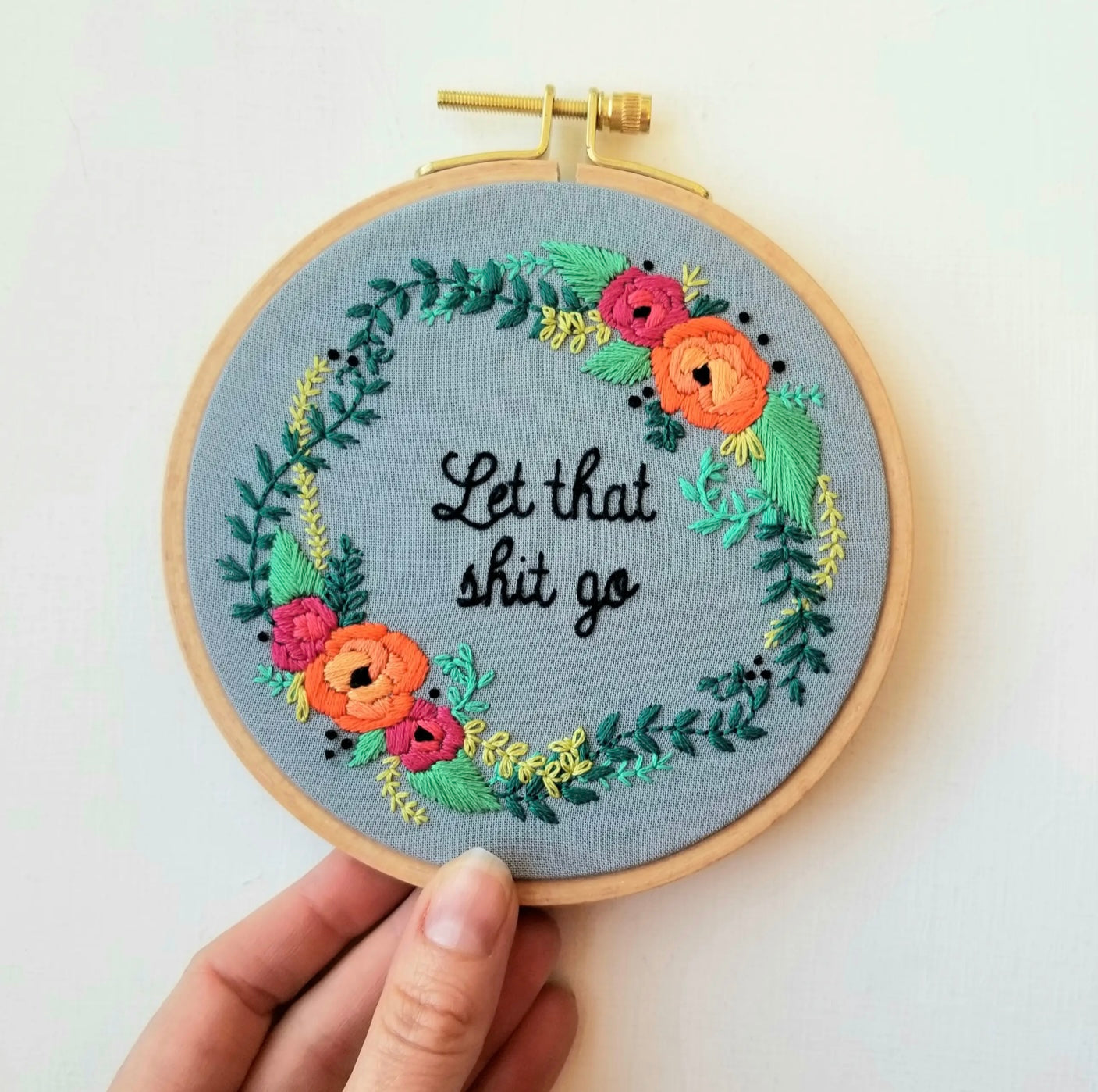 flowers and vines in a circle around words