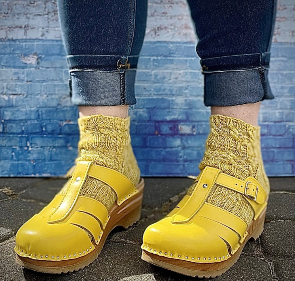 woman wearing clogs and hand knit socks